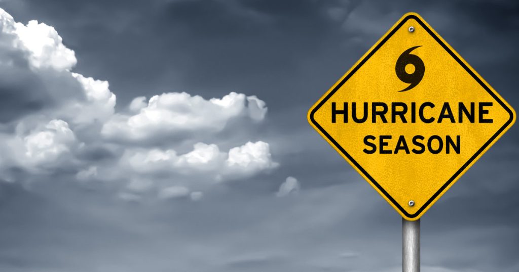 Sign showing Hurricane Season and hurricane symbol.