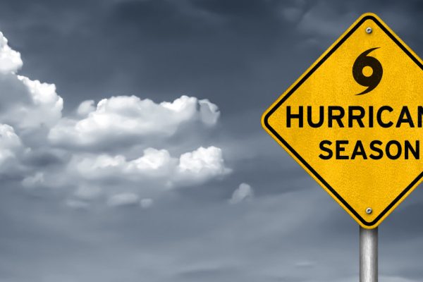 Sign showing Hurricane Season and hurricane symbol.